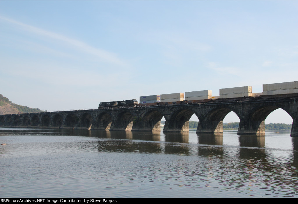 NS 7675 and 9144 take an eastbound over Rockville bridge